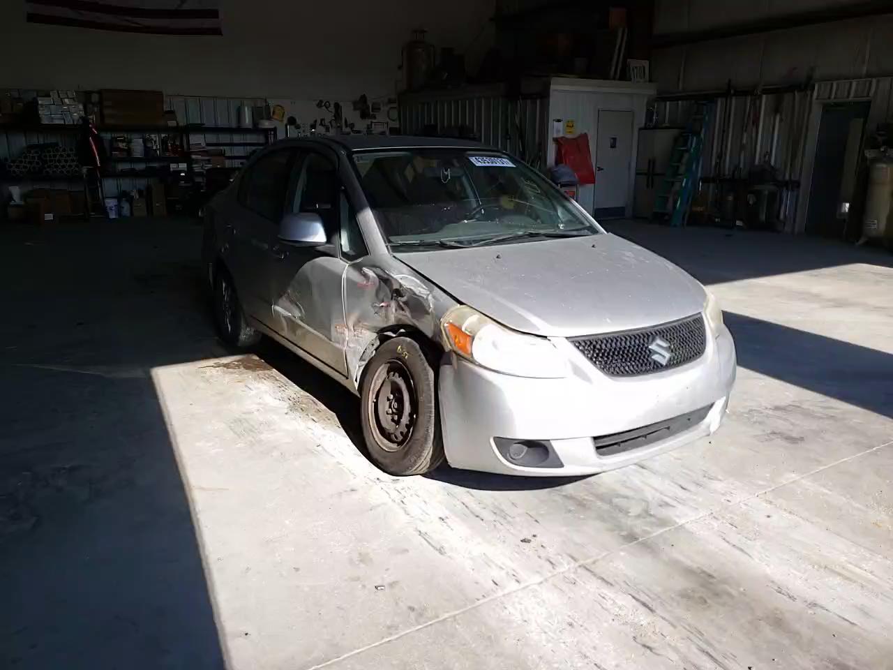 2011 SUZUKI SX4 LE JS2YC5A23B6304257