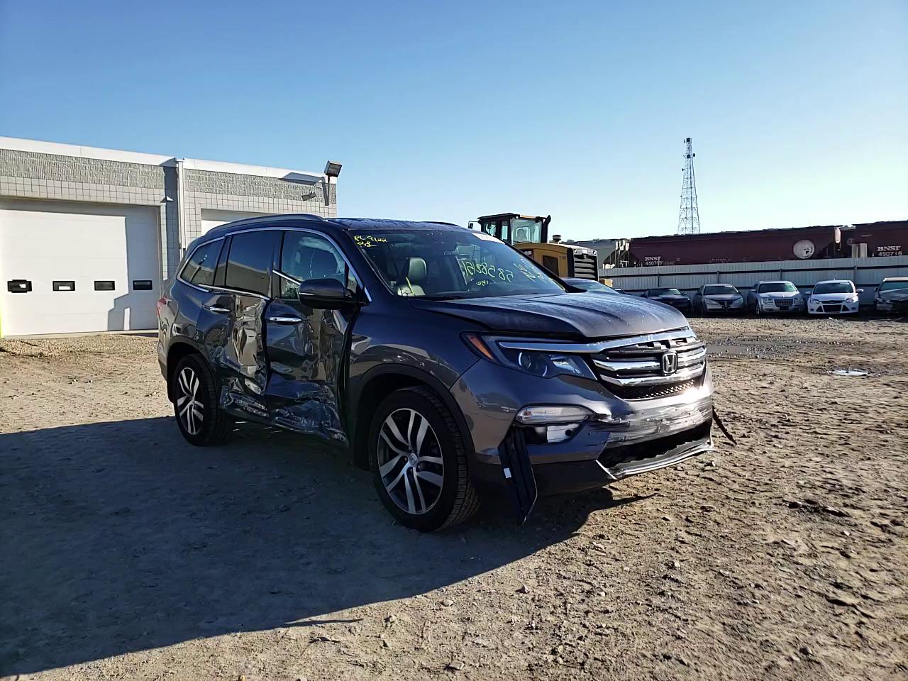 2017 HONDA PILOT ELIT 5FNYF6H01HB012860