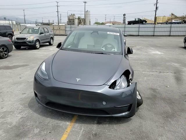 2023 Tesla Model Y VIN: 7SAYGDEE3PF898280 Lot: 56758725