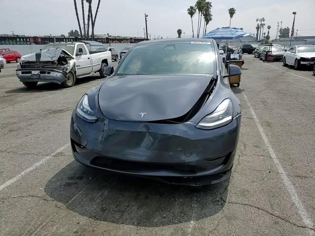 2023 Tesla Model Y VIN: 7SAYGDEE0PA153077 Lot: 58527055