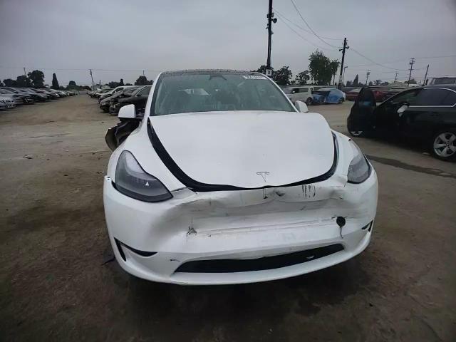 2024 Tesla Model Y VIN: 7SAYGDEE3RA223299 Lot: 58478444