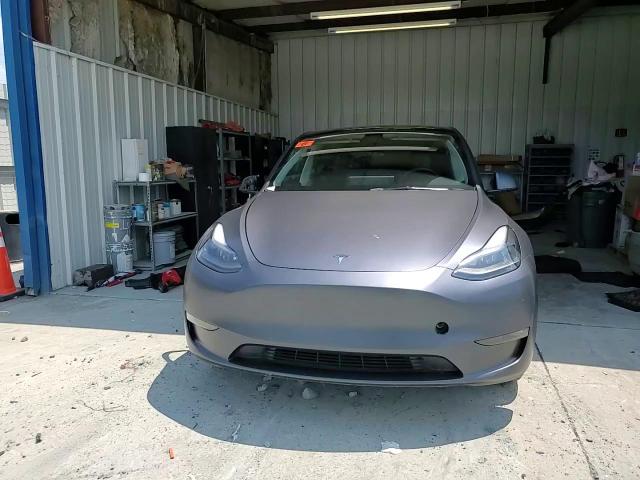 2023 Tesla Model Y VIN: 7SAYGDEE1PF667023 Lot: 60590395