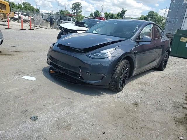 2023 Tesla Model Y VIN: 7SAYGDEE0PA099280 Lot: 63932044