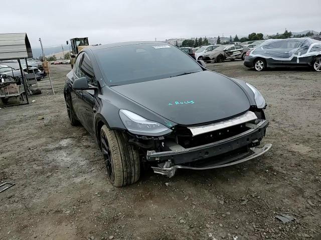 2023 Tesla Model Y VIN: 7SAYGDEE0PF885406 Lot: 65066404