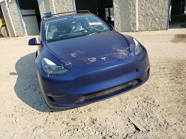 2023 Tesla Model Y VIN: 7SAYGAEE7PF697030 Lot: 66730665