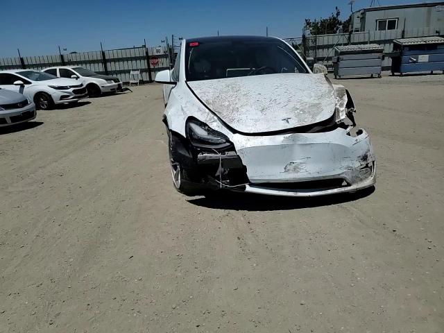 2023 Tesla Model Y VIN: 7SAYGDEE2PF909057 Lot: 64988675