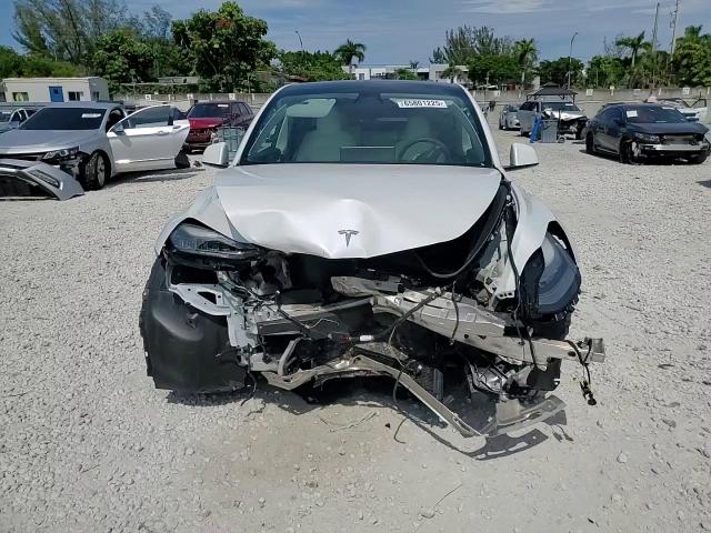 2021 Tesla Model Y VIN: 5YJYGAEE2MF187287 Lot: 65801225
