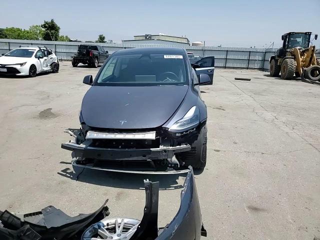 2023 Tesla Model Y VIN: 7SAYGDEE4PF852974 Lot: 64977385