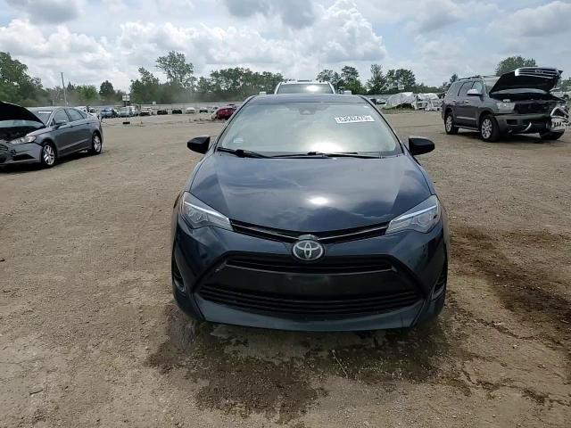 2017 Toyota Corolla L VIN: 5YFBURHE1HP657490 Lot: 63642475