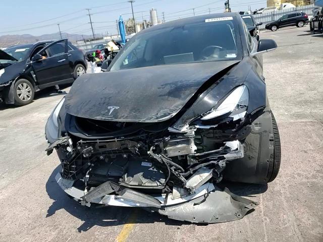 2019 Tesla Model 3 VIN: 5YJ3E1EA6KF397711 Lot: 64999765