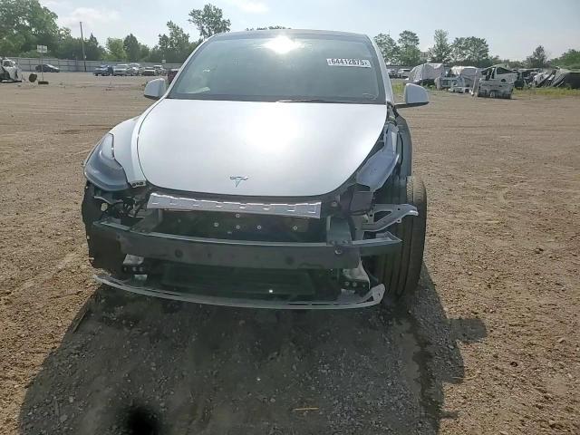 2023 Tesla Model Y VIN: 7SAYGDEE4PF764166 Lot: 64412875