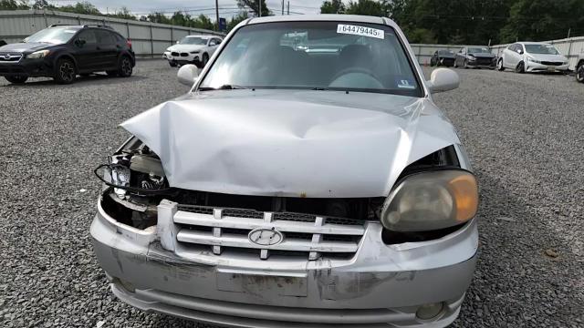 2004 Hyundai Accent Gl VIN: KMHCG35CX4U306713 Lot: 64479445