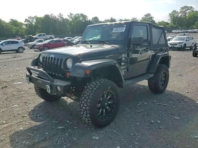 2011 Jeep Wrangler Sahara VIN: 1J4AA5D15BL552185 Lot: 63065185