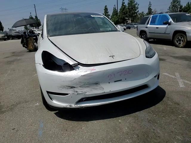 2023 Tesla Model Y VIN: 7SAYGAEE9PF599715 Lot: 65394255