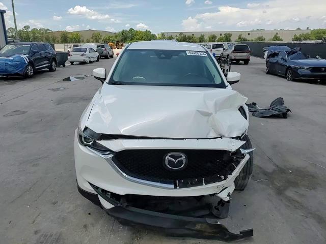 2021 Mazda Cx-5 Touring VIN: JM3KFACM3M0393677 Lot: 64406325