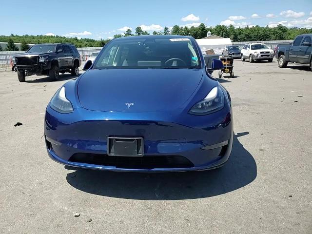 2023 Tesla Model Y VIN: 7SAYGAEE4PF700174 Lot: 65829205