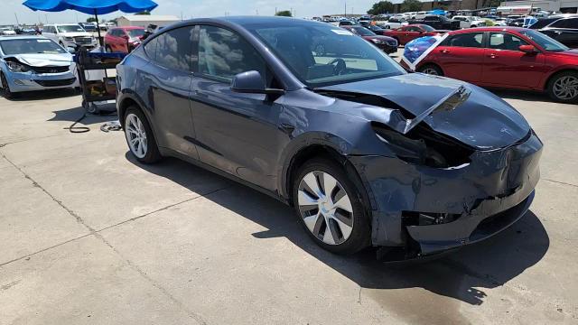 2023 Tesla Model Y VIN: 7SAYGDEE2PA087874 Lot: 66696225