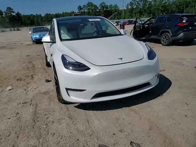 2023 Tesla Model Y VIN: 7SAYGDEE0PF879833 Lot: 66458615