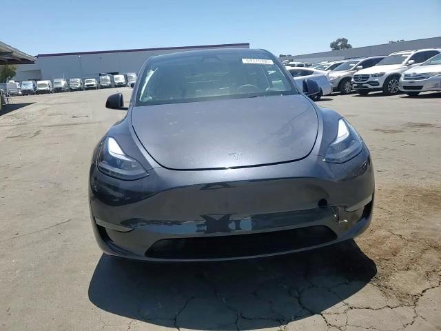 2025 Tesla Model Y VIN: 7SAYGDED2SF280979 Lot: 64315395