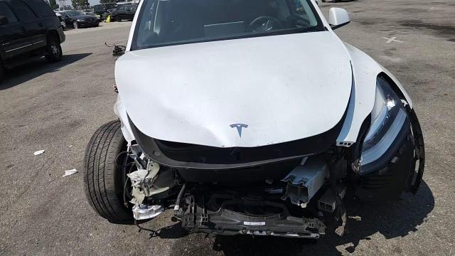 2023 Tesla Model Y VIN: 7SAYGDEE5PA036191 Lot: 65167315