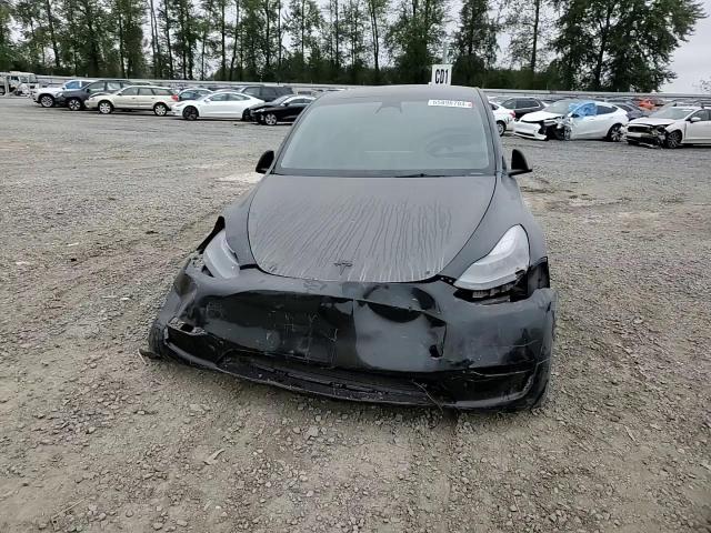 2023 Tesla Model Y VIN: 7SAYGDEF6PF699619 Lot: 65898704