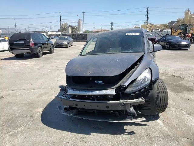 2023 Tesla Model Y VIN: 7SAYGDEE5PA076769 Lot: 68548854