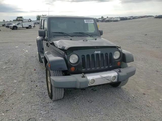 2008 Jeep Wrangler Unlimited Sahara VIN: 1J8GA59158L611567 Lot: 66905644