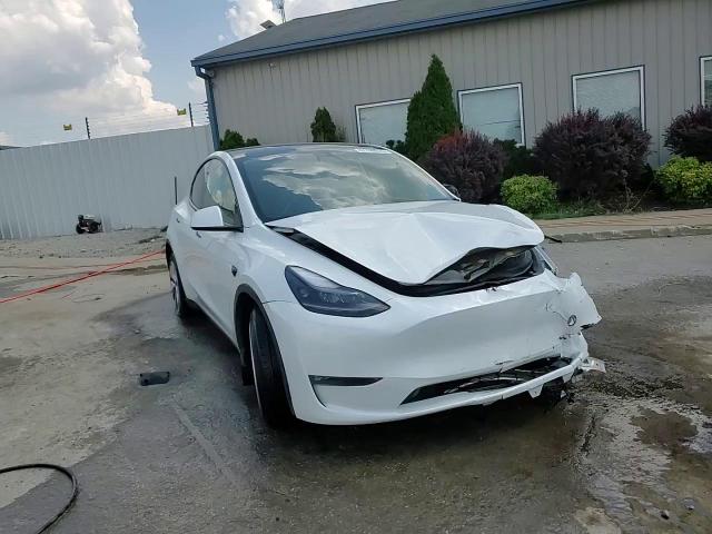 2023 Tesla Model Y VIN: 7SAYGDEE7PF694677 Lot: 67743655
