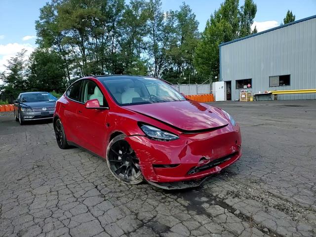 2023 Tesla Model Y VIN: 7SAYGAEE6PF785809 Lot: 68217675