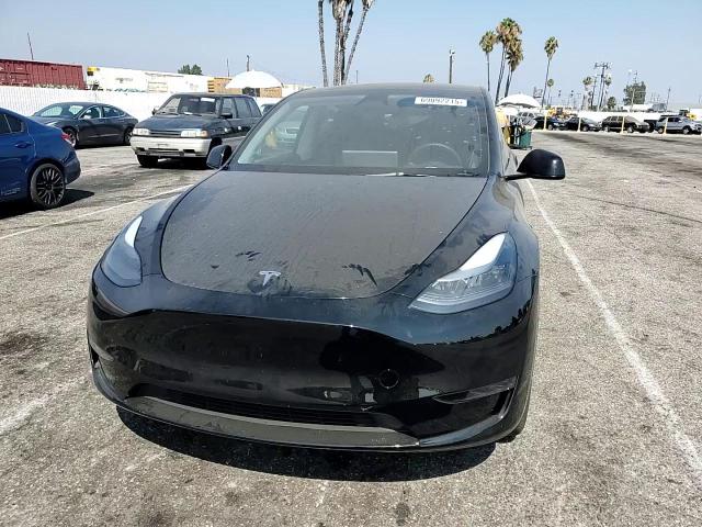 2025 Tesla Model Y VIN: 7SAYGDED2SF308702 Lot: 69092215