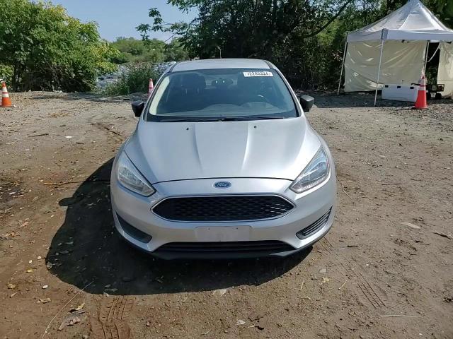 2015 Ford Focus S VIN: 1FADP3E24FL297618 Lot: 72283324