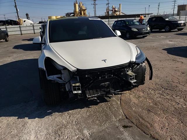 2023 Tesla Model Y VIN: 7SAYGDEF9PF693765 Lot: 70685324