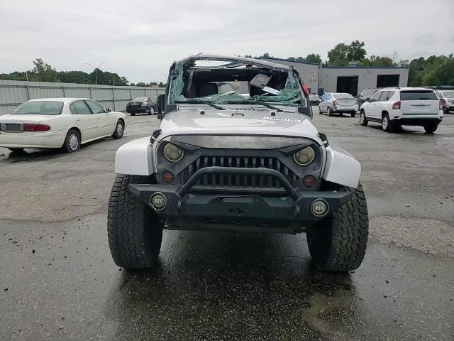 2011 Jeep Wrangler Unlimited Sahara VIN: 1J4BA5H14BL554640 Lot: 73009134