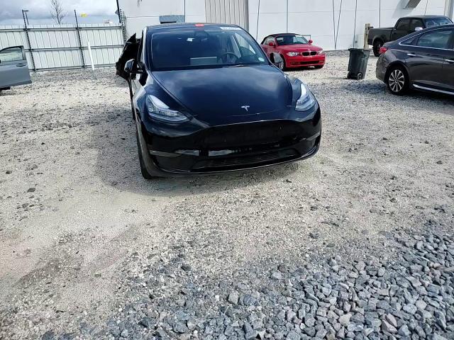2023 Tesla Model Y VIN: 7SAYGDEE0PA077103 Lot: 80123705