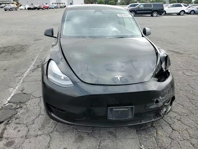 2023 Tesla Model Y VIN: 7SAYGDEE4PA184090 Lot: 80556985