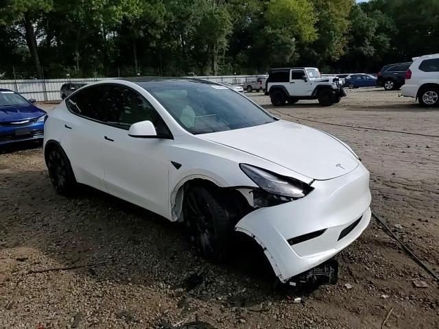 2023 Tesla Model Y VIN: 7SAYGDEF1PF705018 Lot: 82044395