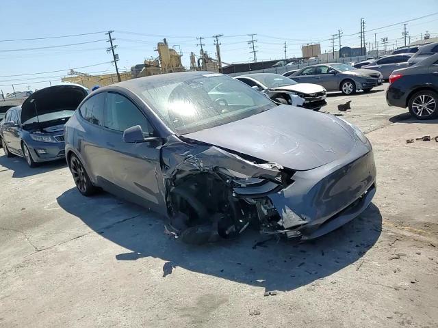 2023 Tesla Model Y VIN: 7SAYGAEE6PF710527 Lot: 71622925