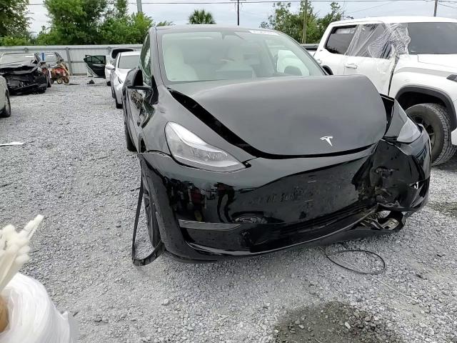 2024 Tesla Model Y VIN: 7SAYGDEF0RA309209 Lot: 71587035