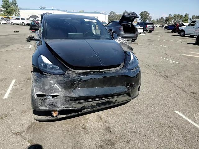 2023 Tesla Model Y VIN: 7SAYGDEE4PF907889 Lot: 83761445