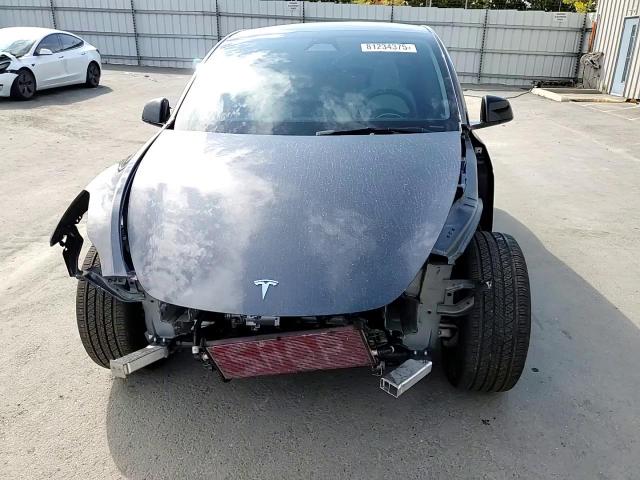 2025 Tesla Model Y VIN: 7SAYGAEE0SF245316 Lot: 81234375