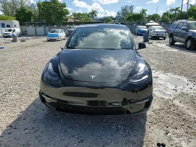 2023 Tesla Model Y VIN: 7SAYGDEF0PF660573 Lot: 80920165