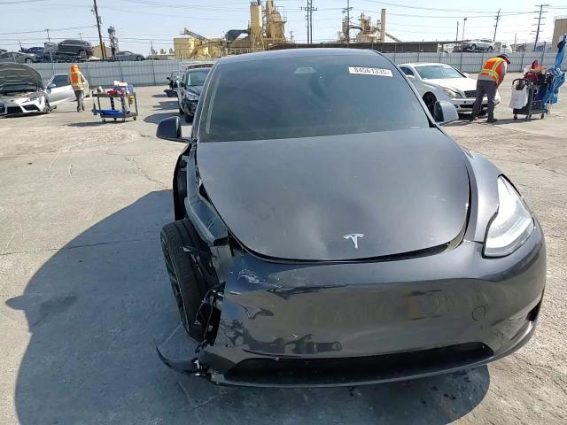 2025 Tesla Model Y VIN: 7SAYGAEE2SF216576 Lot: 84561335