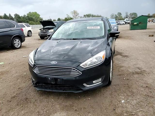 2016 Ford Focus Titanium VIN: 1FADP3N23GL302616 Lot: 81018465