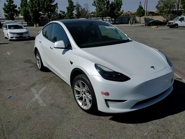 2023 Tesla Model Y VIN: 7SAYGAEE4PF786487 Lot: 76937874