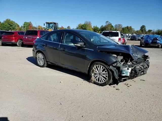 2016 Ford Focus Titanium VIN: 1FADP3J21GL273560 Lot: 76248424