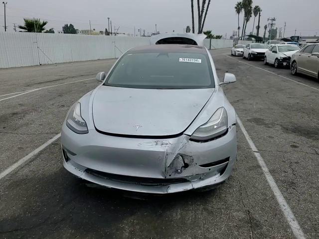 2018 Tesla Model 3 VIN: 5YJ3E1EA4JF049792 Lot: 76143134