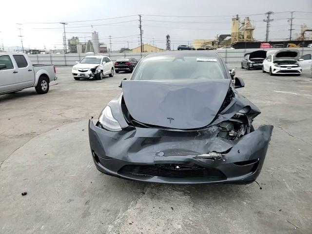 2023 Tesla Model Y VIN: 7SAYGDEF5PF957855 Lot: 77710014