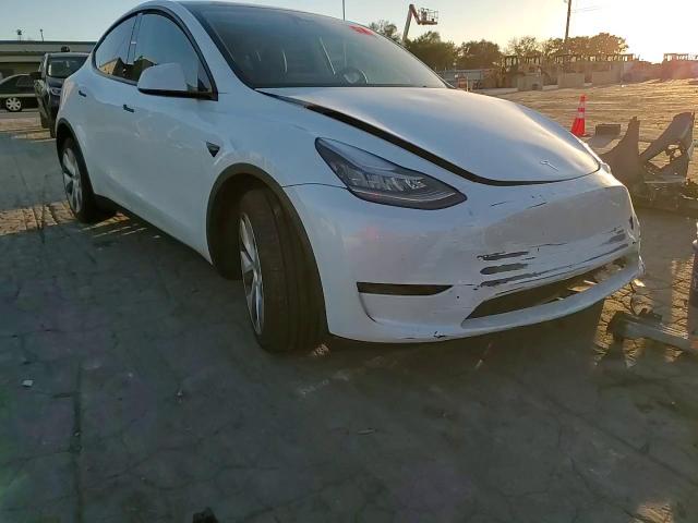 2023 Tesla Model Y VIN: 7SAYGDEE1PA129001 Lot: 74830714