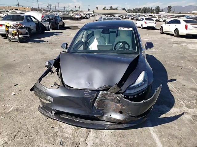 2019 Tesla Model 3 VIN: 5YJ3E1EBXKF195737 Lot: 77692344