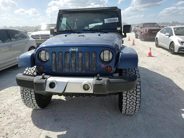 2009 Jeep Wrangler Unlimited Sahara VIN: 1J4GB59199L773976 Lot: 76906864